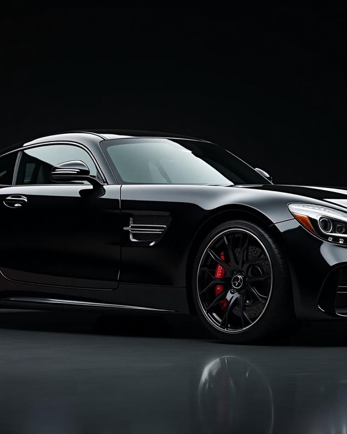 A dark luxury car with a deep, glossy detailed finish