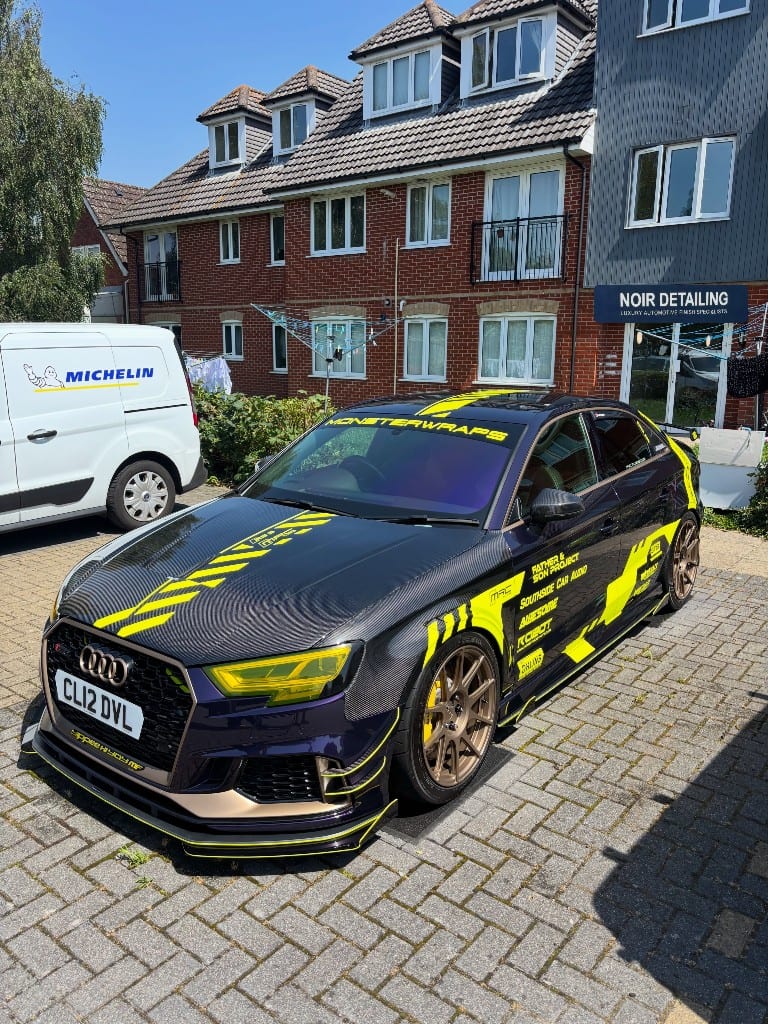 Purple carbon-wrapped Audi RS3 show car detailed by Noir Detailing, front three-quarter view
