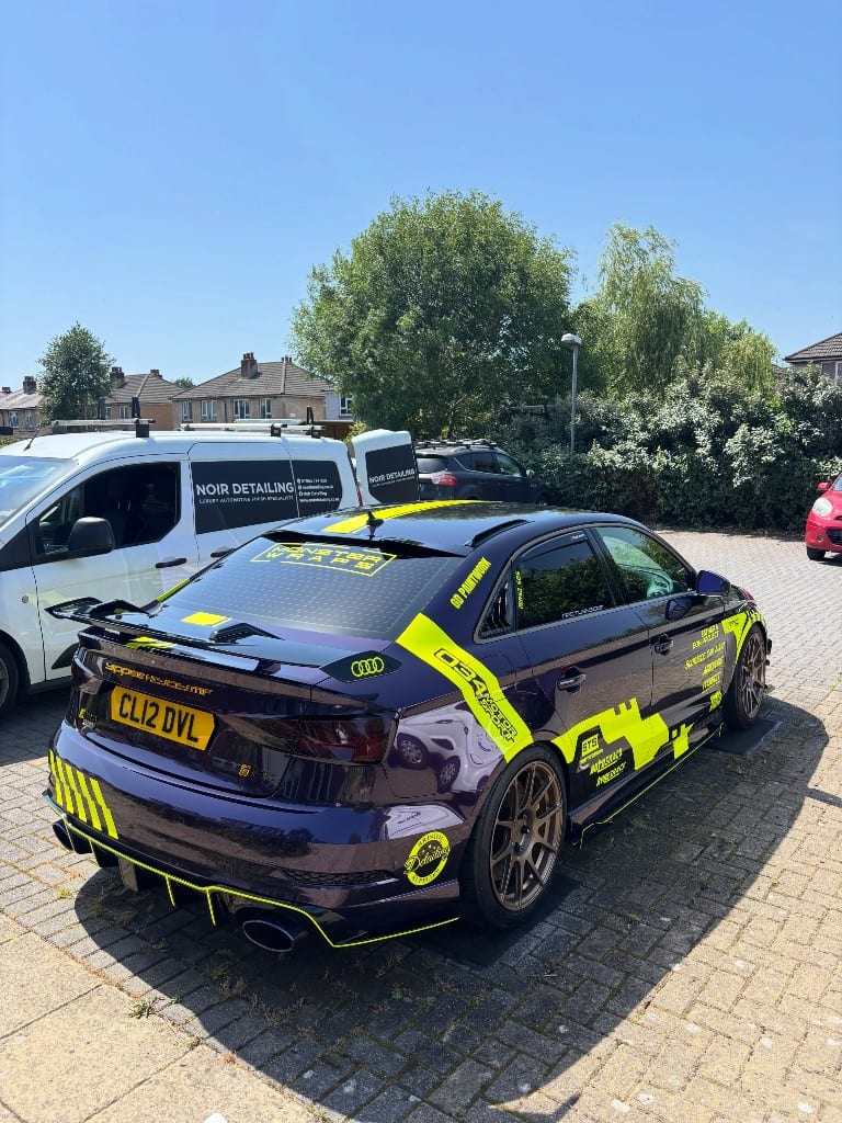 Purple Audi RS3 show car rear view with Noir Detailing vans behind