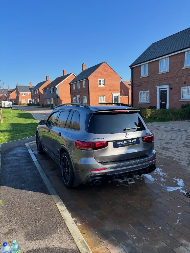 Mercedes-AMG GLB being hand washed on a driveway by Noir Detailing