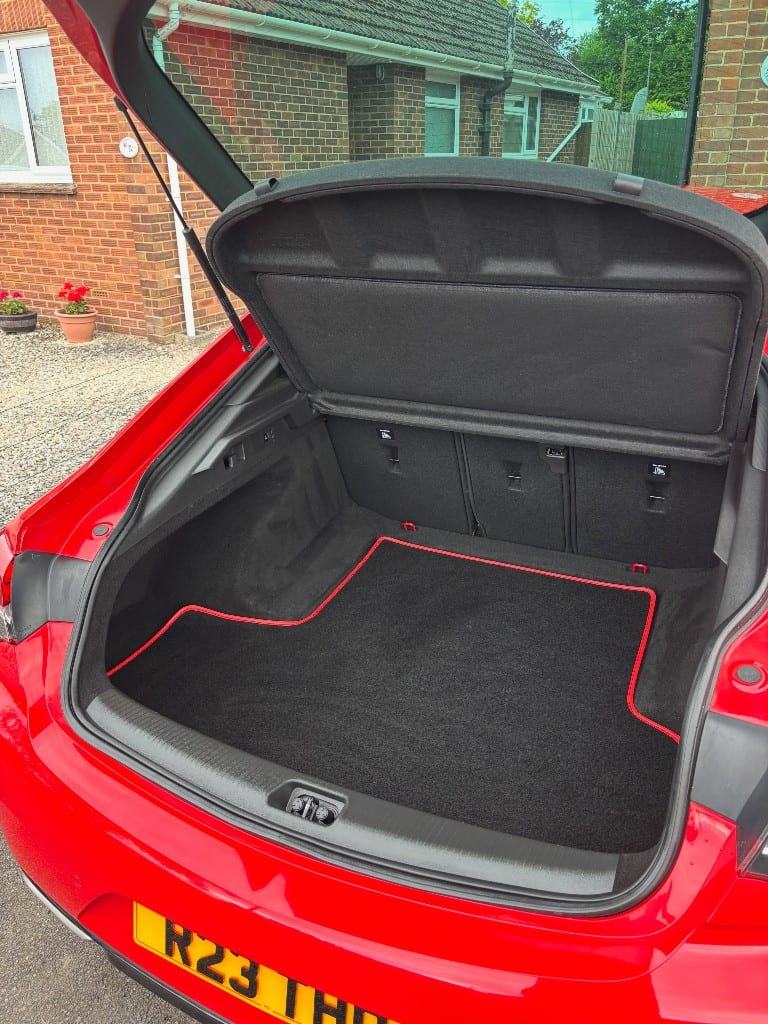 Car boot vacuumed and dressed with a clean fitted mat after detailing