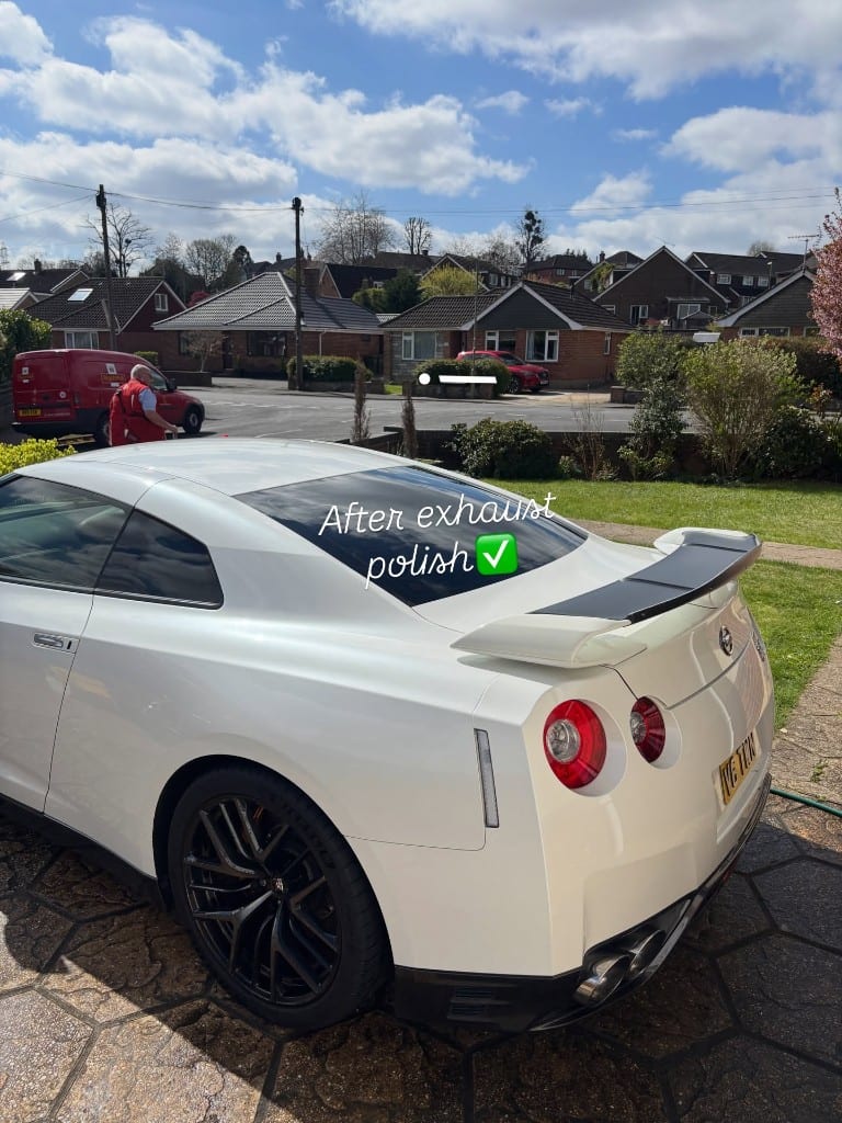 White Nissan GT-R gleaming after a machine polish and exhaust tip polish