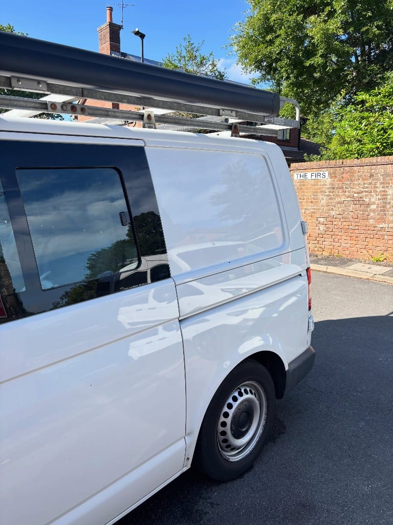 White VW Transporter panel cleaned and decontaminated to an even, clean finish