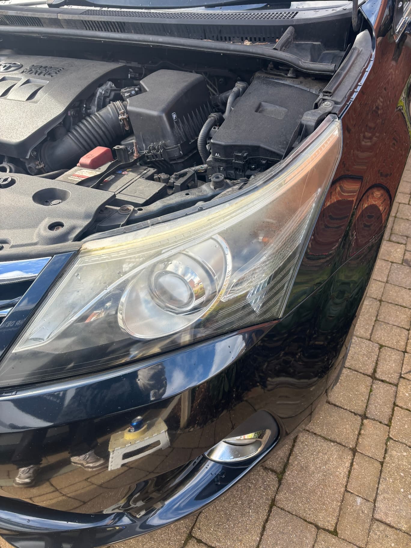 Headlight before restoration — yellowed and hazy